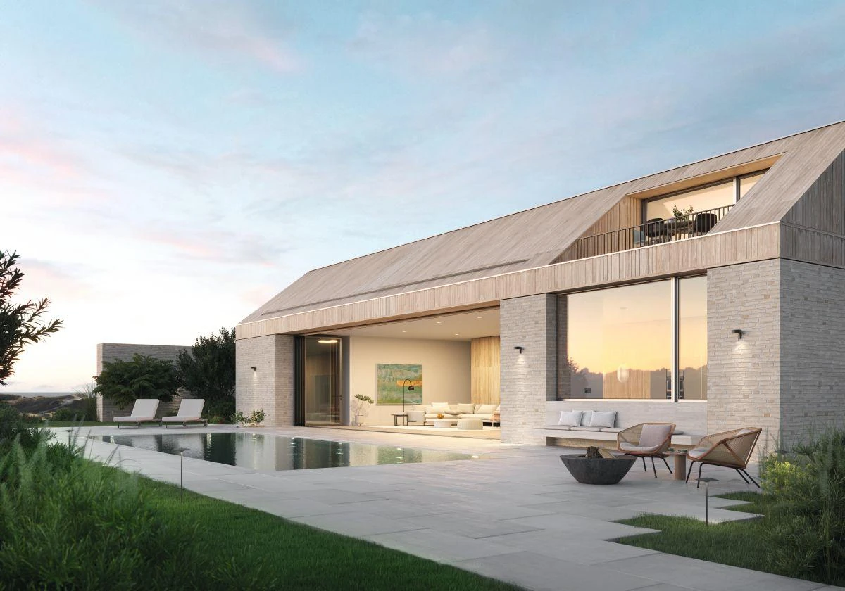 Contemporary home with a Schüco bifold wall opened toward the pool