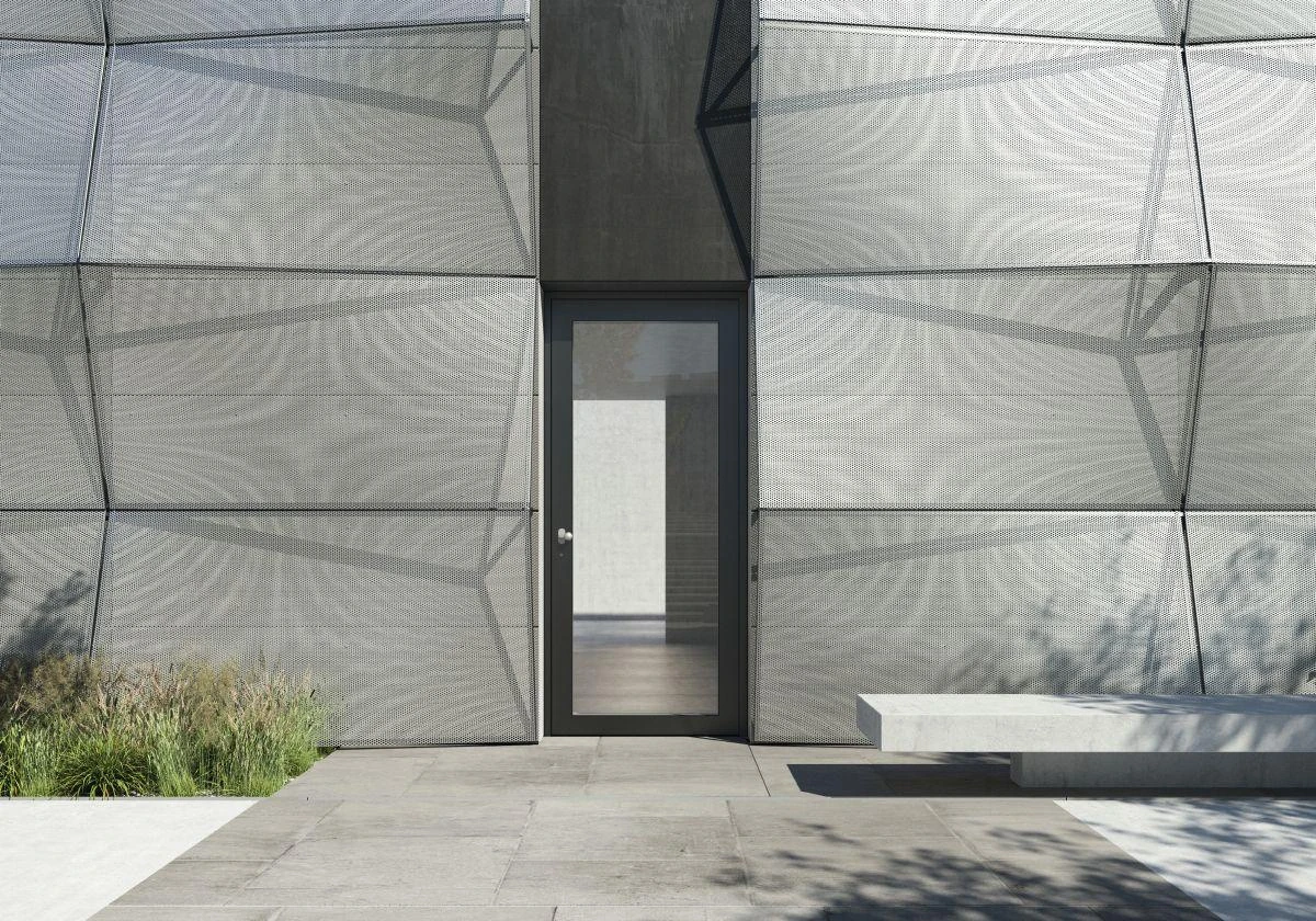 Narrow glazed aluminum commercial entrance door in a metal facade