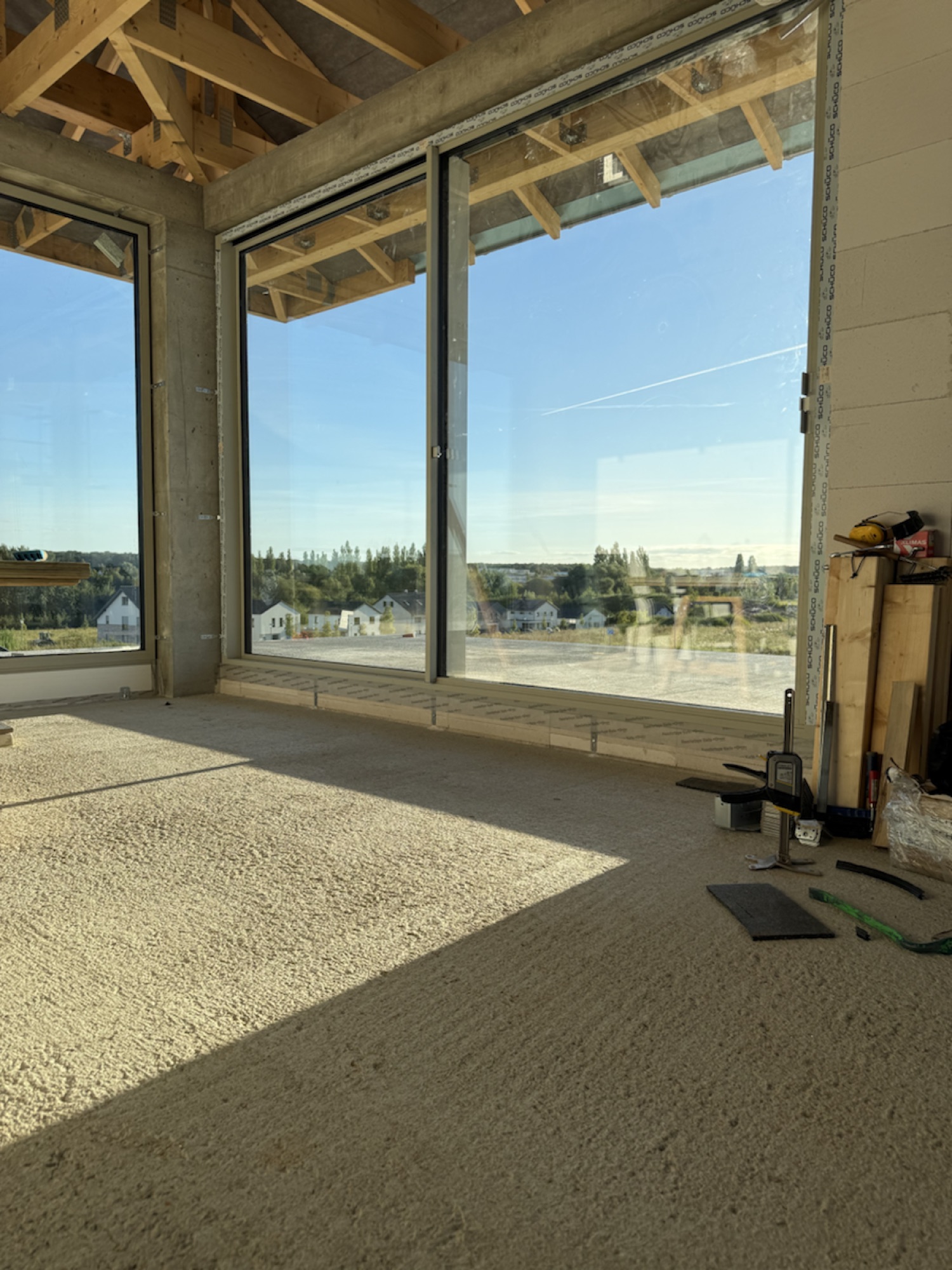 Large-format Schüco AWS 75.SI+ window wall in a new-build living space in Neubrandenburg